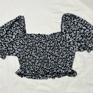 small Haute Monde floral top. Black with white and purple flower pattern.